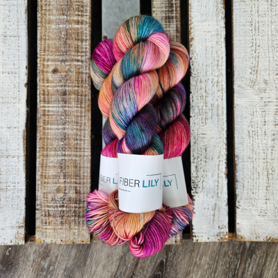 Three skeins of pink and blue hand dye yarn